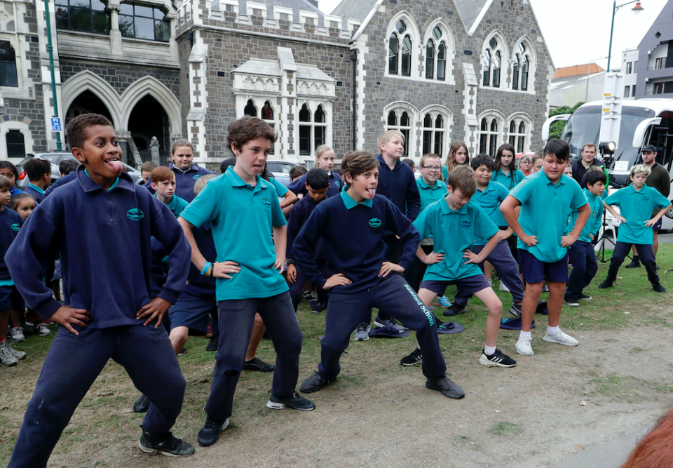 <em>Children form Bamford Primary school perform a haka during a visit to the floral tribute to the victims (AP)</em>