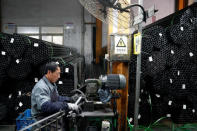 An employee works on the production line of Kent bicycles at Shanghai General Sports Co., Ltd, in Kunshan, Jiangsu Province, China, February 22, 2019. Picture taken February 22, 2019. REUTERS/Aly Song