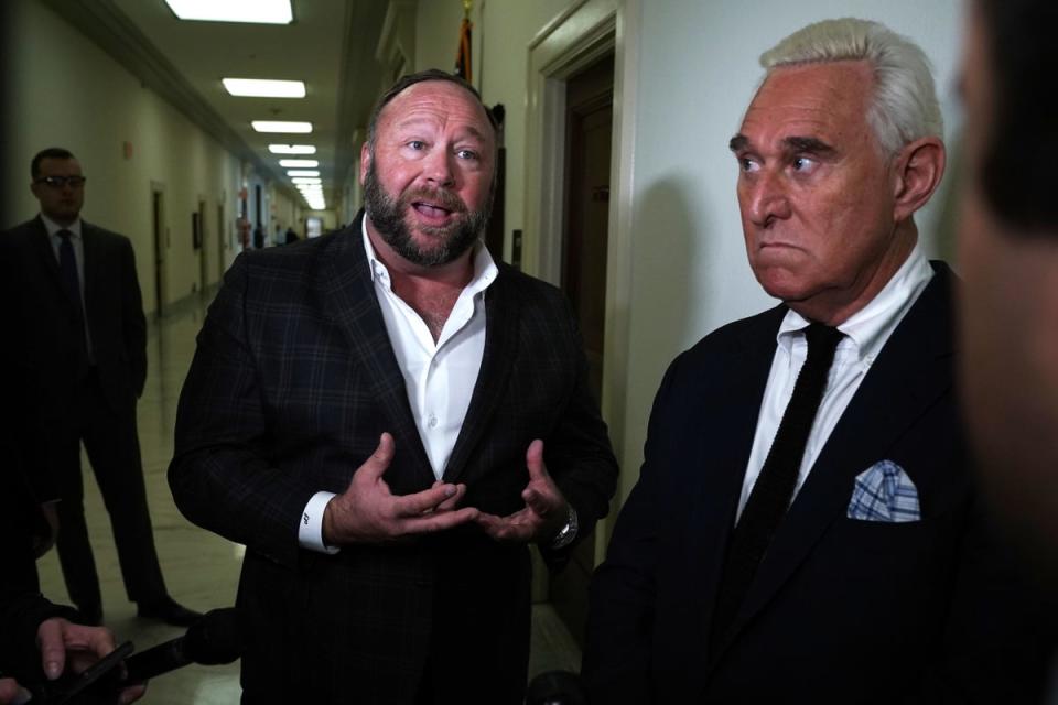 Alex Jones and Roger Stone were among those pleading the Fifth. They are pictured together in Washington DC in 2018 (Getty Images)