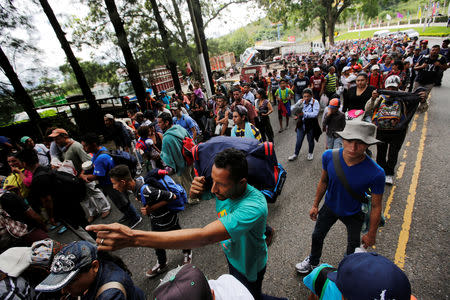 Honduran migrants, part of a caravan trying to reach the U.S., are seen during a new leg of their travel in Esquipulas, Guatemala October 16, 2018. REUTERS/Jorge Cabrera