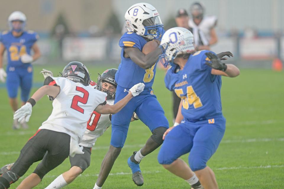 Ontario's Bodpegn Miller scrambles for yardage Friday night against Marion Pleasant.