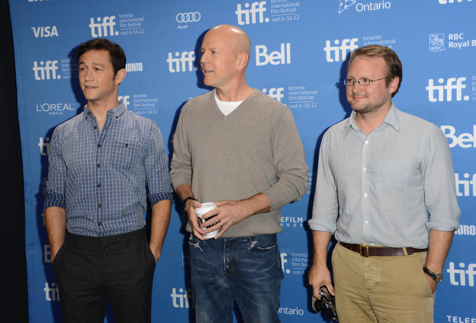 TORONTO, ON - SEPTEMBER 06: (L-R) Actor/Producer Joseph Gordon-Levitt, actor Bruce Willis and Writer/Director Rian Johnson pose at the "Looper" photo call during the 2012 Toronto International Film Festival at TIFF Bell Lightbox on September 6, 2012 in Toronto, Canada. (Photo by Jason Merritt/Getty Images)