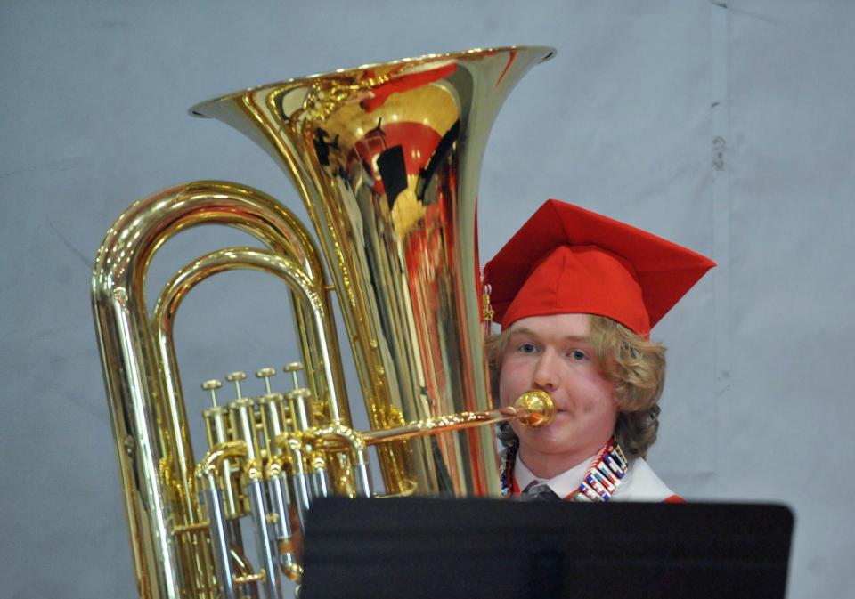 Milton High School Band senior member Tim Fay performs on the tuba.