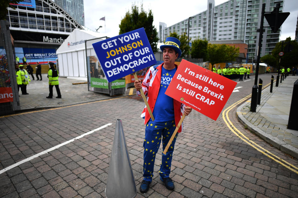 MANCHESTER, ENGLAND - SEPTEMBER 28: Anti-Brexit campaigner Steve Bray holds placards outside the Conservative Party Conference on September 28, 2019 in Manchester, England. Despite Parliament voting against a government motion to award a recess, Conservative Party Conference still goes ahead. Parliament will continue with its business for the duration. (Photo by Jeff J Mitchell/Getty Images)