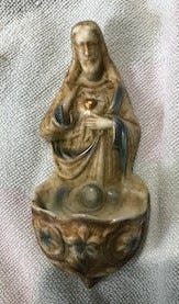 This porcelain holy water figural wall pockets marked “Germany” were likely made before World War I.