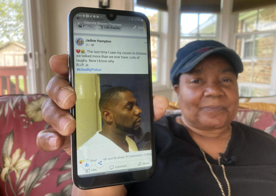 Glenda Brown Thomas displays a photo of her nephew, Andrew Brown Jr., on her cell phone at her home in Elizabeth City, N.C., on Thursday, April 22, 2021. Brown was shot and killed Wednesday by a sheriff's deputy, who was attempting to execute a warrant. (AP Photo/Allen G. Breed)