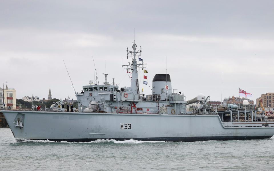 A ship of the slightly larger Hunt class, like HMS Chiddingfold, seen entering Portsmouth harbour