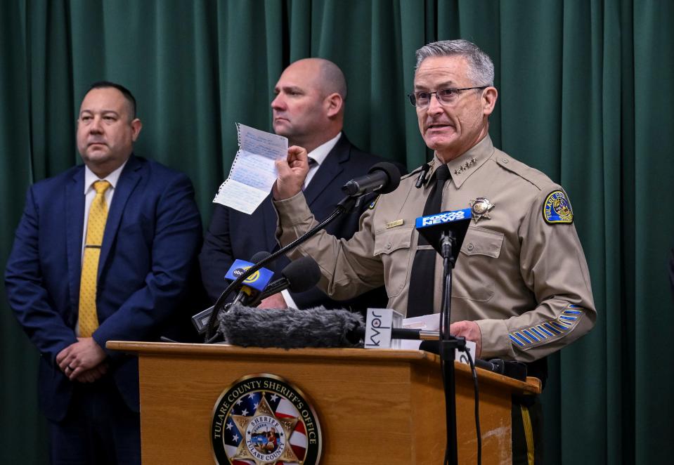 Tulare County Sheriff Mike Boudreaux holds a letter Monday, January 30, 2023 from a Maine woman that sent $100 to add to the reward offered for information about a mass shooting that occurred January 16 in Goshen. No arrests were announced but autopsies confirmed that all six victims died from gunshot wounds.