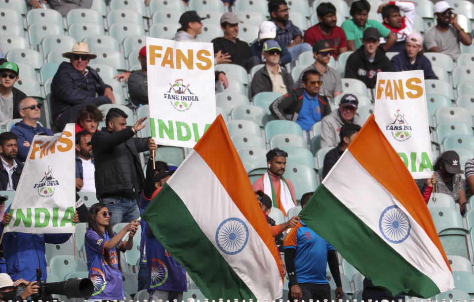 Indian fans watch play on day three of the second cricket test between India and Australia at the Melbourne Cricket Ground, Melbourne, Australia, Monday, Dec. 28, 2020. (AP Photo/Asanka Brendon Ratnayake)