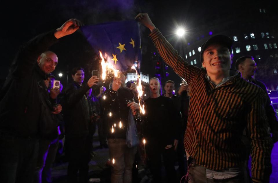 Brexit supporters burn a EU flag on a London protest last month (PA)