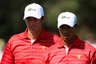 MELBOURNE, AUSTRALIA - NOVEMBER 18: (L-R) Dustin Johnson of the U.S. Team and teammate Tiger Woods evaluate a putt on the first hole green during the Day Two Four-Ball Matches of the 2011 Presidents Cup at Royal Melbourne Golf Course on November 18, 2011 in Melbourne, Australia. (Photo by Scott Halleran/Getty Images)