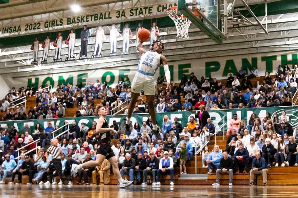 Saint Joseph's Jayce Lee (24) dunks during the Saint Joseph vs. John Glenn boys regional championship basketball game Saturday, March 9, 2024 at Washington High School.