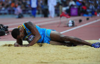 LONDON, ENGLAND - AUGUST 09: Leevan Sands of the Bahamas lays on the sand after getting injured in the Men's Triple Jump Final on Day 13 of the London 2012 Olympic Games at Olympic Stadium on August 9, 2012 in London, England. (Photo by Stu Forster/Getty Images)