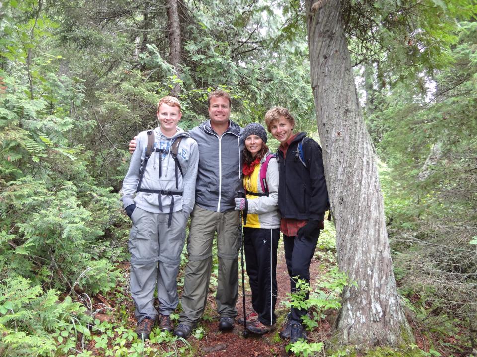 The Goldsteins huddle up for a photo while hiking at Isle Royale National Park in Michigan.