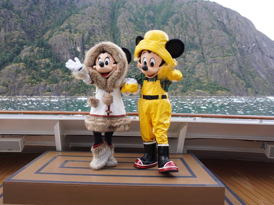 Minnie and Mickey Mouse wave to guests on a Disney cruise in Alaska.