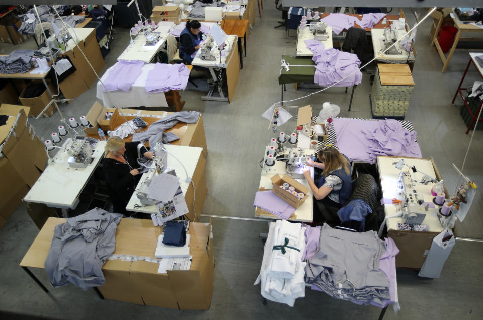  energy  Tibard employees make NHS uniforms at their factory in Dukinfield as the spread of the coronavirus disease (COVID-19) continues, Dukinfield, Britain, April 6, 2020. REUTERS/Molly Darlington