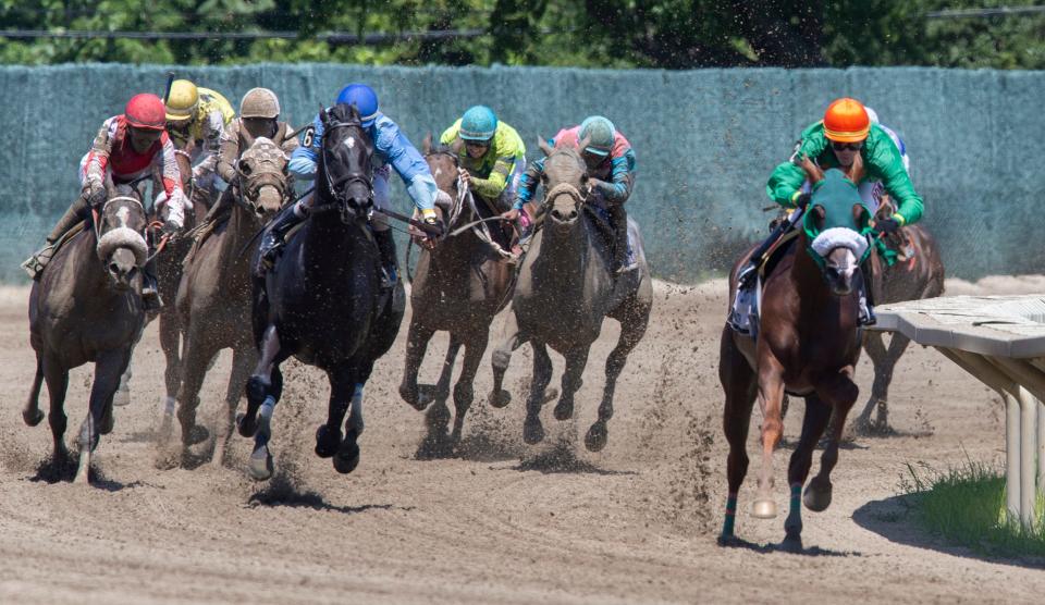 Horses turn for the home stretch during the fourth race of the day. 2020 Haskell Invitational at Monmouth Park, NJ on July 18, 2020 in Oceanport, NJ. 