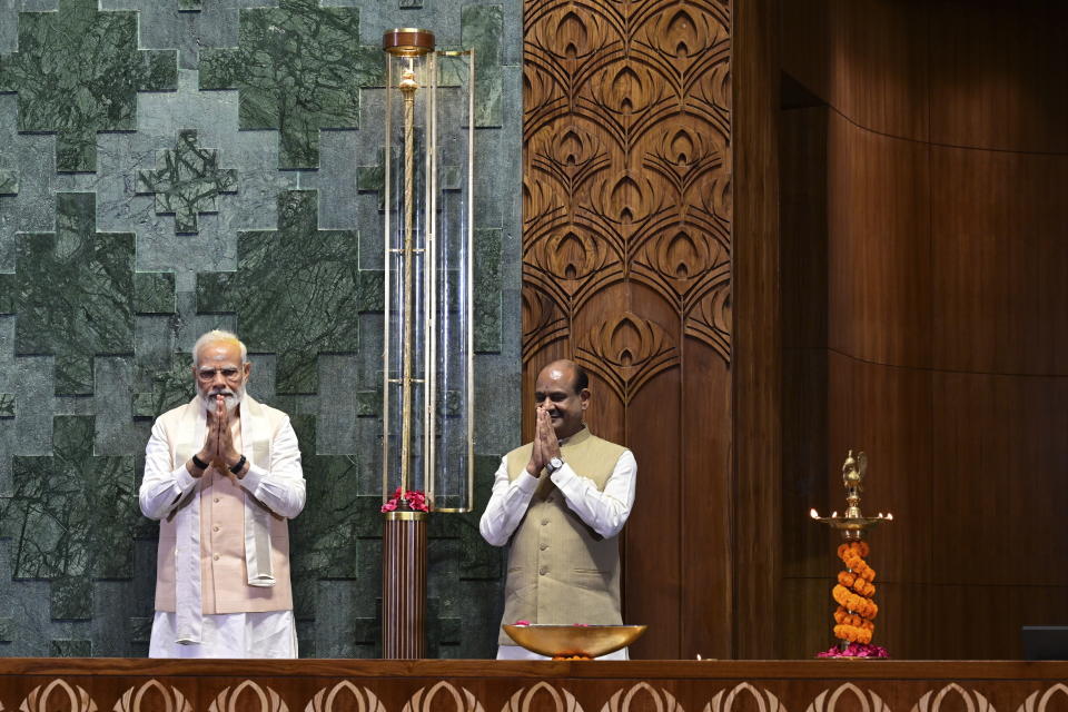 Indian prime minister Narendra Modi, left, with speaker of the lower house Om Birla greet after installing a royal golden sceptre near the chair of the speaker during the start of the inaugural ceremony of the new parliament building, in New Delhi, India, Sunday, May 28, 2023. The new triangular parliament building, built at an estimated cost of $120 million, is part of a $2.8 billion revamp of British-era offices and residences in central New Delhi called "Central Vista", even as India's major opposition parties boycotted the inauguration of a new parliament building by Modi, in a rare show of unity against the Hindu nationalist ruling party that has completed nine years in power and is seeking a third term in crucial general elections next year. (AP Photo)