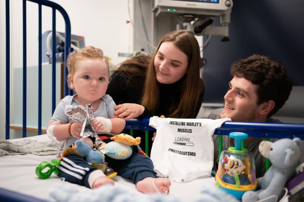 Rosie-Mae Walton and Wes Powell with their son Marley as he recovers at Sheffield Children’s Hospital after receiving the ;most expensive drug in the world;, the genetic treatment Zolgensma (Joe Giddens/PA) (PA Wire)