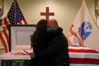 FILE PHOTO: Mourners attend a funeral for a Texas man who died of COVID-19