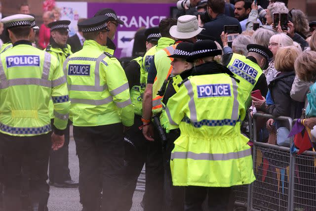 <p>Neil Mockford/GC Images</p> Protester let off smoke at the wedding of the Duke of Westminster on June 7, 2024