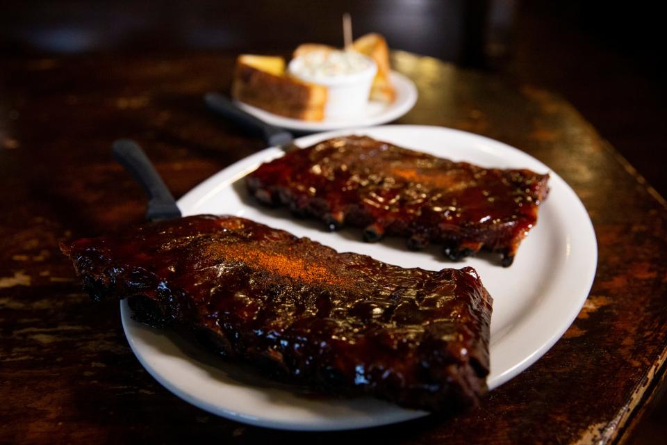 A plate of glazed ribs along with Texas toast and slaw can be seen at The Bar-B-Q Shop in Memphis, Tenn., on Thursday, April 6, 2023.