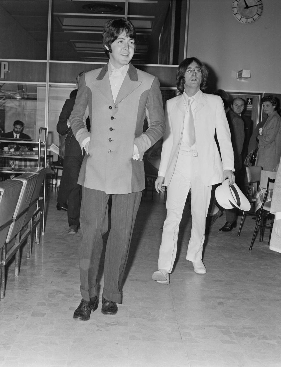 British musicians of the Beatles, Paul McCartney and John Lennon (1940 - 1980) at Heathrow Airport, London, UK, 12th May 1968. (Photo by Dove/Daily Express/Getty Images)