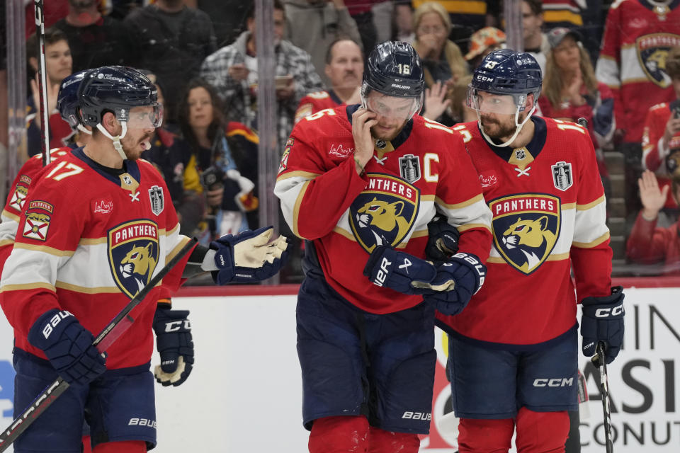 Florida Panthers center Aleksander Barkov (16) is assisted by teammates after he was injured during the third period of Game 2 of the NHL hockey Stanley Cup Finals against the Edmonton Oilers, Monday, June 10, 2024, in Sunrise, Fla. (AP Photo/Wilfredo Lee)