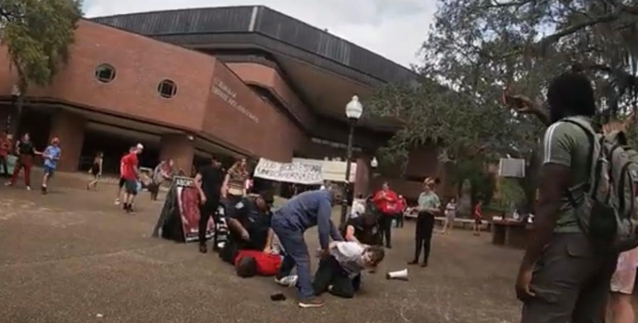 University of Florida police arrest two people at Turlington Plaza during a counter protest to anti-abortion display.
