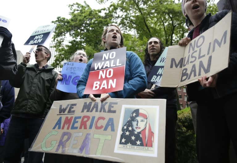 People protest outside the 9th US Circuit Court of Appeals in Seattle, Washington on May 15, 2017