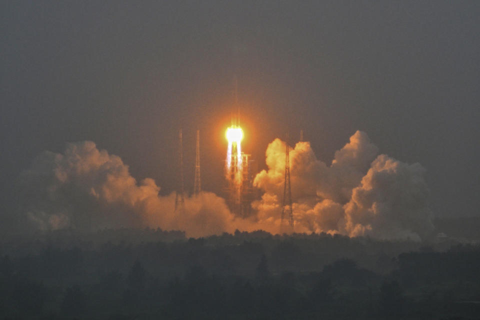 A Long March 5 rocket, carrying the Chang'e-6 mission lunar probe, lifts off  (Hector Retamal / AFP - Getty Images)