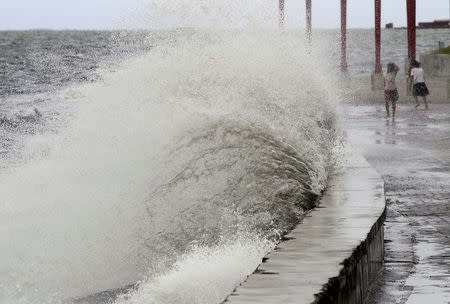 Big waves crash at the coast due to strong winds brought by Typhoon Goni, locally named as Ineng, at the Manila bay in Navotas city, north of Manila August 20, 2015. REUTERS/Romeo Ranoco