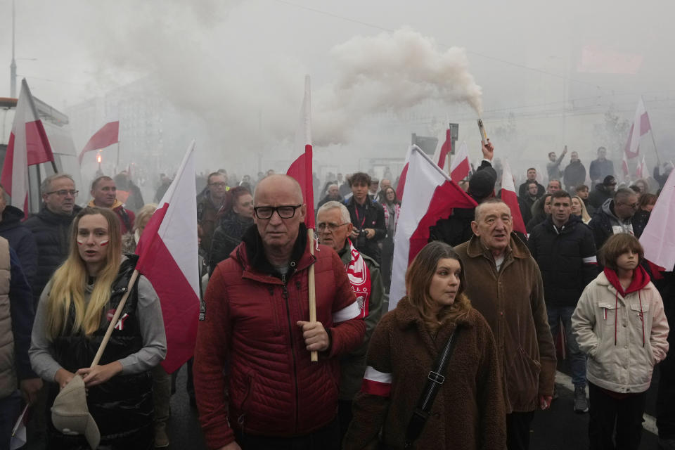 People take part in a yearly march on Poland's Independence Day holiday in Warsaw, Poland, on Saturday, Nov. 11, 2023. The Independence Day holiday celebrates the restoration of Poland's national sovereignty in 1918, at the end of World War I and after 123 years of foreign rule. (AP Photo/Czarek Sokolowski)
