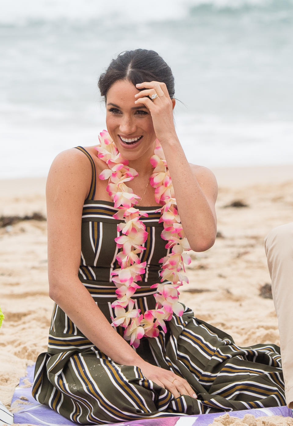 Meghan wears a striped Martin Grant maxi dress on a visit to Bondi Beach in 2018 [Photo via Getty Images]