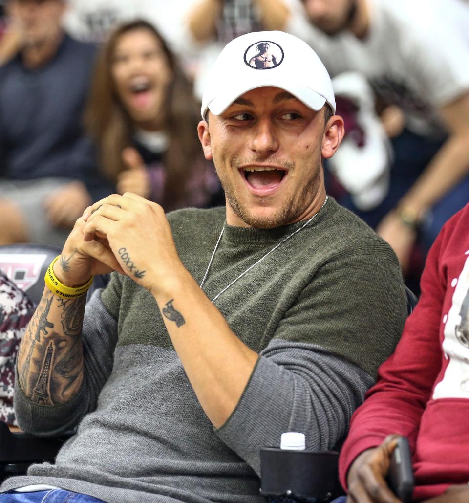 Former Texas A&M quarterback and 2012 Heisman Trophy winner Johnny Manziel watches a basketball game against Kentucky at Reed Arena in College Station, Texas on March 4, 2017.
