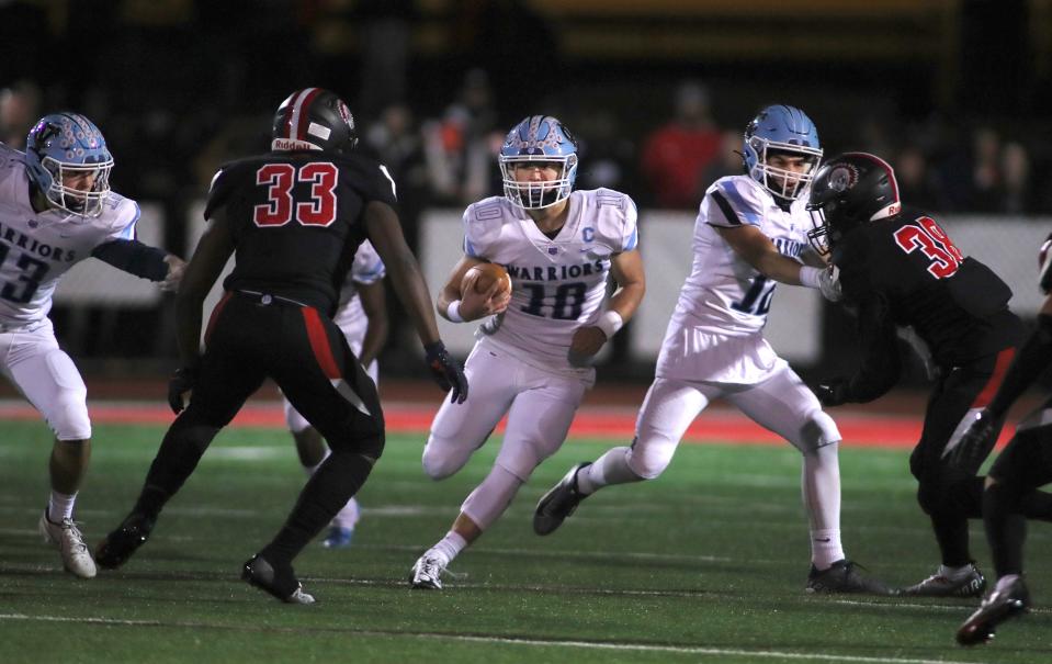 Central Valley's Bret FitzSimmons (10) looks to get around Aliquippa's Jayace Williams (33) after finding a hole in Aliquippa's defensive line during the first half Friday night at Jimbo Covert Field in Freedom, PA.