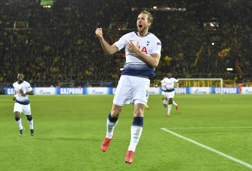 Tottenham forward Harry Kane celebrates after scoring the opening goal during the Champions League round of 16, 2nd leg, soccer match between Borussia Dortmund and Tottenham Hotspur at the BVB stadium in Dortmund, Germany, Tuesday, March 5, 2019. (Bernd Thissen/dpa via AP)