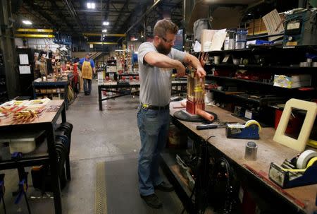 Sub-assembly worker Joel Dykema works on the sub-assembly of a transformer in the RoMan Manufacturing plant in Grand Rapids, Michigan, U.S. December 12, 2018. Picture taken December 12, 2018. REUTERS/Rebecca Cook