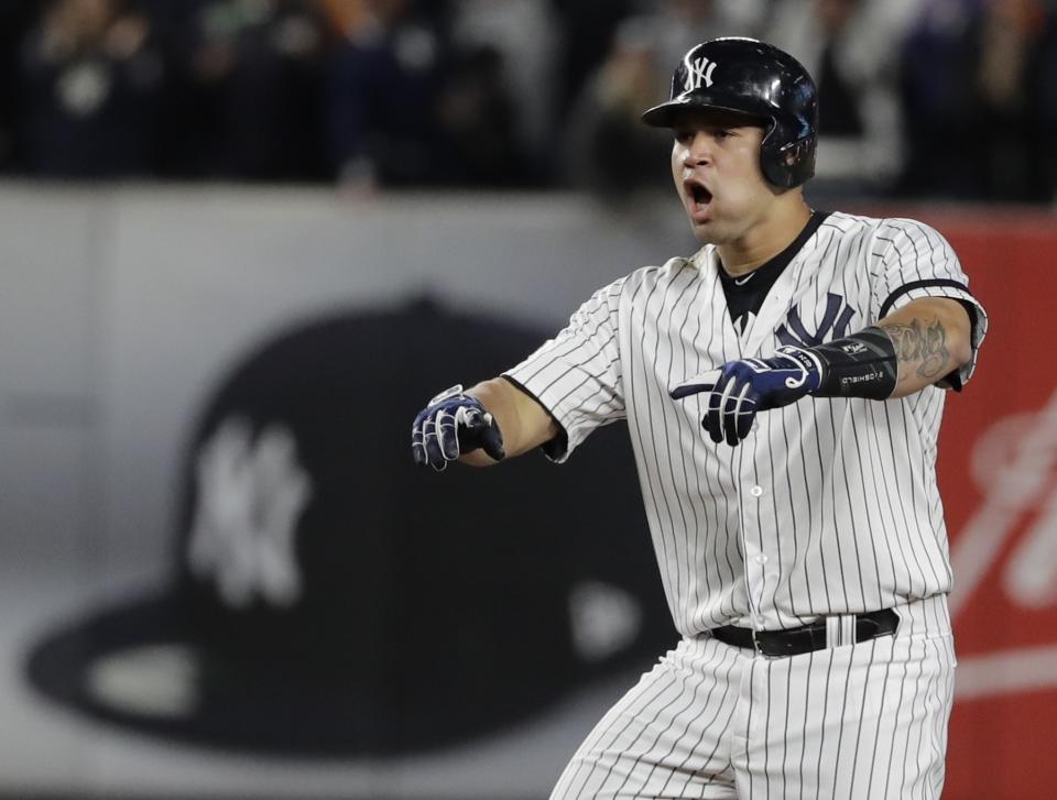 Gary Sanchez reacts after hitting a two-run scoring double during the eighth inning of Game 4 of the ALCS. (AP)