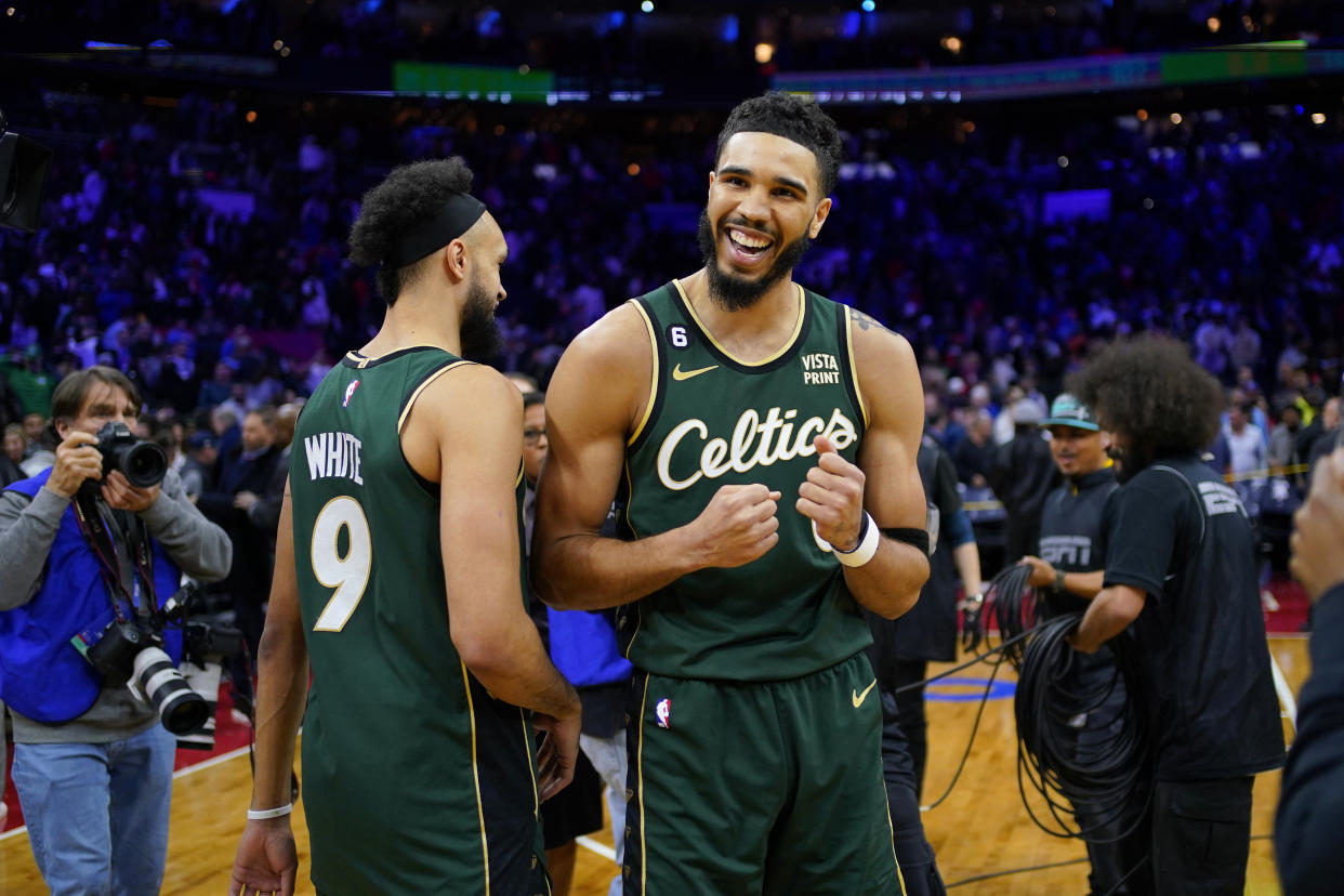 Boston Celtics' Jayson Tatum, right, and Derrick White celebrate after an NBA basketball game against the Philadelphia 76ers, Saturday, Feb. 25, 2023, in Philadelphia. (AP Photo/Matt Slocum)