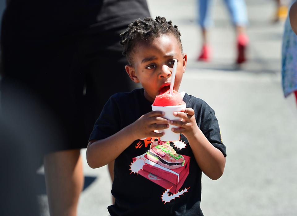 Crowds day and night came to Spring Fling 2022 in downtown Spartanburg. With bands and foods as well as rides; everyone could find something to do at last year's Spring Fling. Eli Washington, 4, of Spartanburg digs in his ice treat.