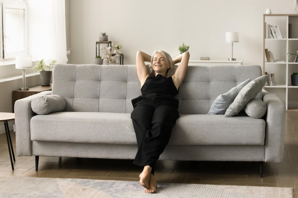 A woman relaxing on a couch