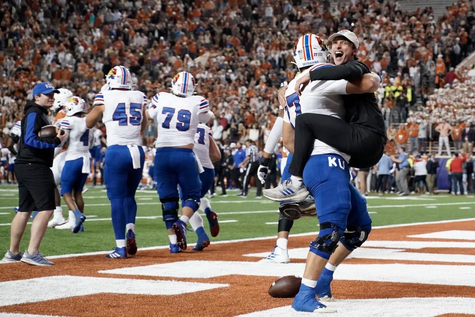 Kansas players celebrate the 57-56 overtime win over Texas at Royal-Memorial Stadium on Nov. 13. The Jayhawks secured the upset on a 2-point conversion in overtime.