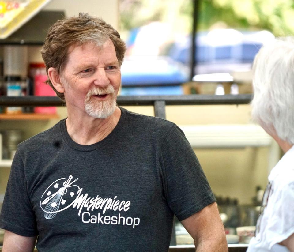 Masterpiece Cakeshop owner Jack Phillips talks with a customer following a Supreme Court ruling in 2018.