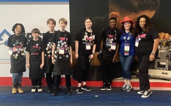 Landmark Middle's robotics team at the Lego League world championship: from left, Zoey Takamine; siblings Jayden, Briar and Carson Agidius; Grace Pendergraft; Kam'Ron Diamond; missing, Kamaurie Sutherland. Far right: Coach Avis Collier, with league rep Lesley Rester.