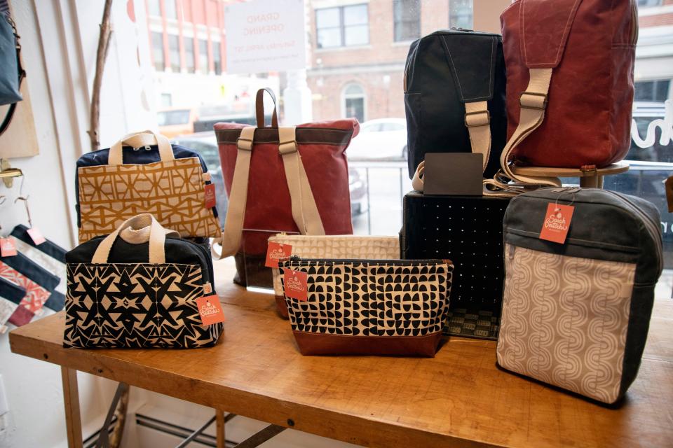 These handmade bags, screenprinted and created by Sarah Bertochi, are on sale at Bertochi's store in downtown Hudson, March 23, 2023.