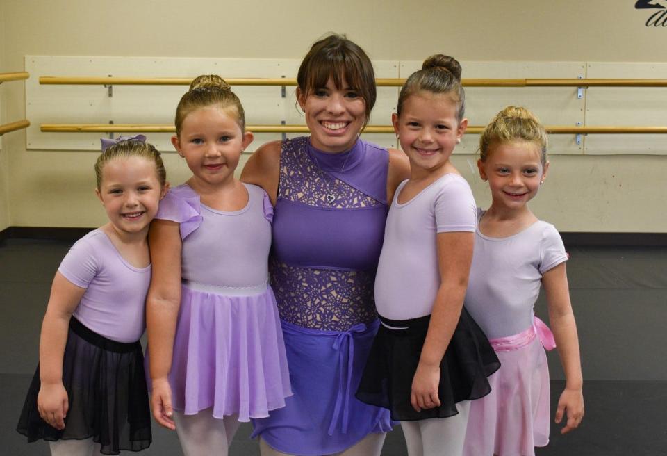 Director of Dance Kassandra Ringle, center, poses with students, from left, Quinn Neisler, Rylea Robles, Josephine Keegan and Harmony Snyder.