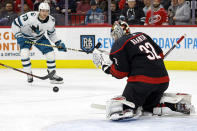 San Jose Sharks' Noah Gregor (73) has his shot bounce off Carolina Hurricanes goaltender Antti Raanta (32) during the first period of an NHL hockey game in Raleigh, N.C., Friday, Jan. 27, 2023. (AP Photo/Karl B DeBlaker)