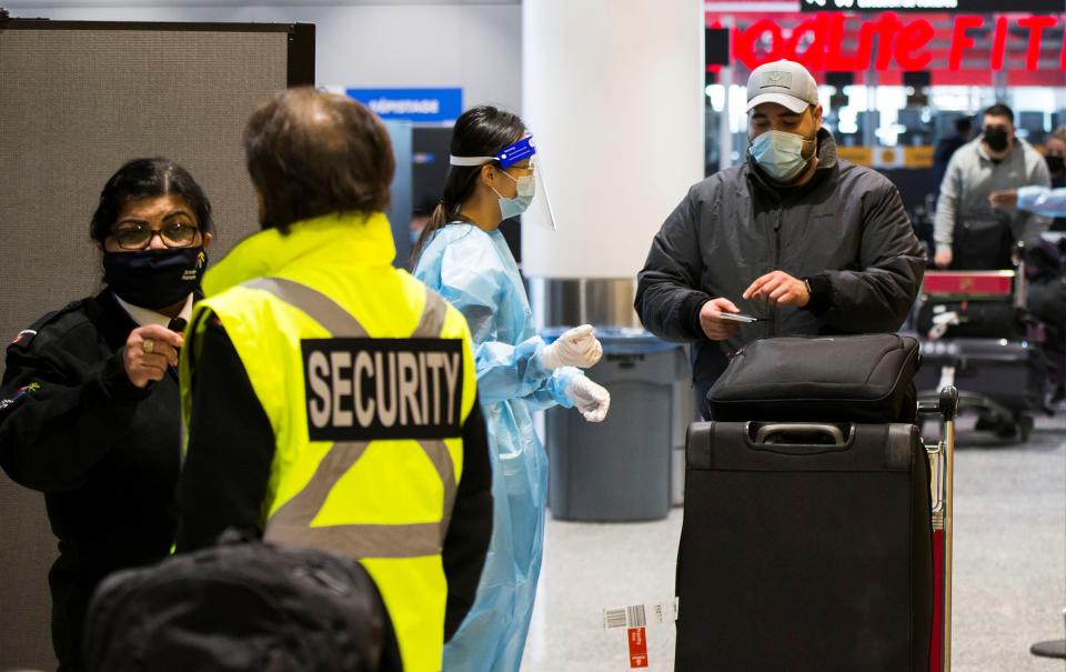 TORONTO, Feb. 1, 2021 -- A traveller wearing a face mask shows his test certificate at the exit of a COVID-19 testing site at Toronto International Airport in Mississauga, Ontario, Canada, on Feb. 1, 2021. Canada's Ontario required all international arriving passengers to take a COVID-19 test upon arrival starting on Monday to stop the spread of COVID-19 variants. (Photo by Zou Zheng/Xinhua via Getty) (Xinhua/Zou Zheng via Getty Images)