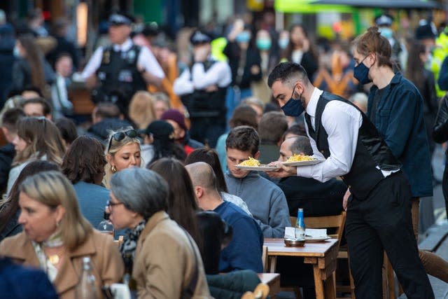 A waiter serving customers 